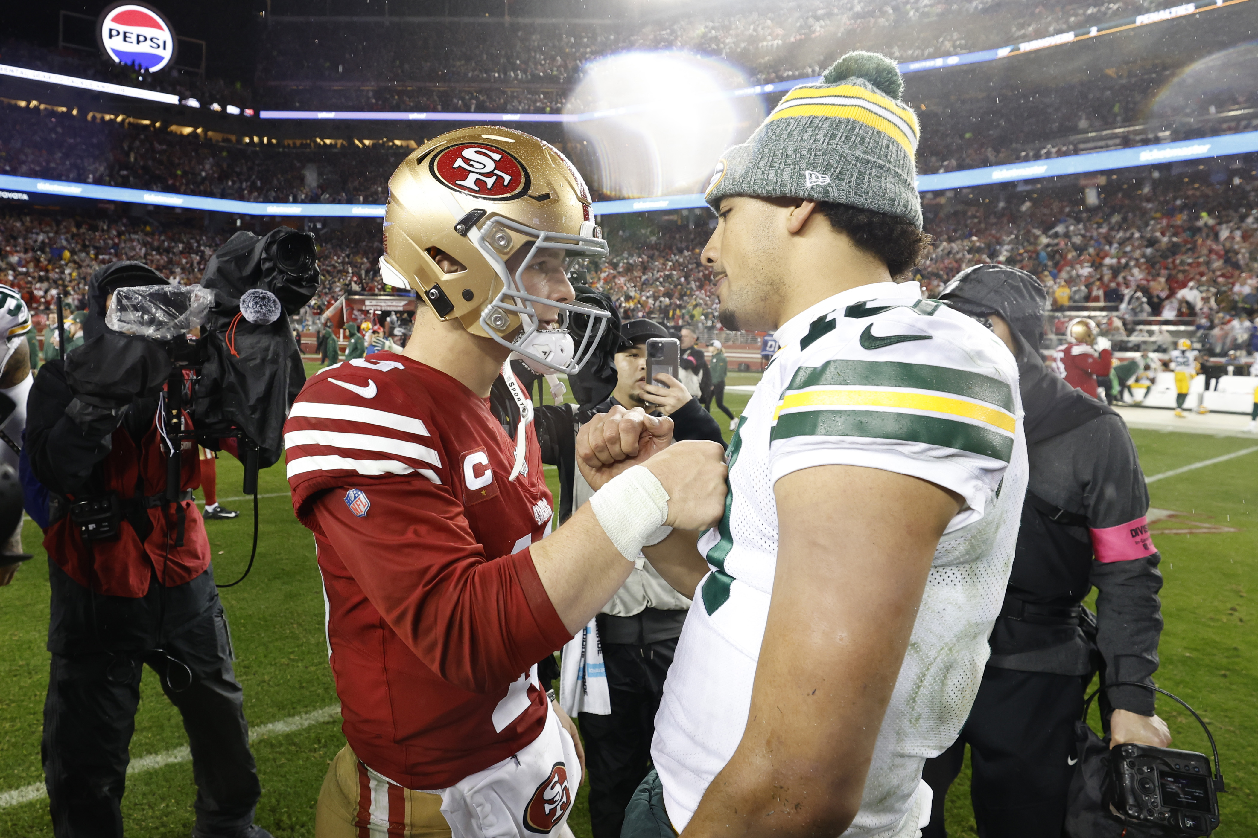 Brock Purdy #13 of the San Francisco 49ers greets Jordan Love #10 of the Green Bay Packers after the 49ers defeated the Packers 24-21 in the NFC Divisional Playoffs at Levi’s Stadium on January 20, 2024 in Santa Clara, California.