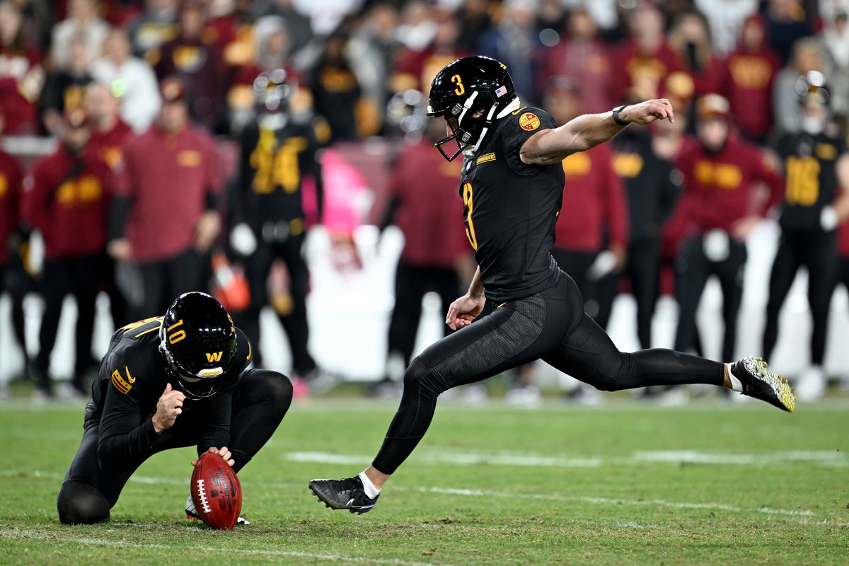 Austin Seibert #3 of the Washington Commanders attempts a field goal against the Chicago Bears at Northwest Stadium on October 27, 2024 in Landover, Maryland.